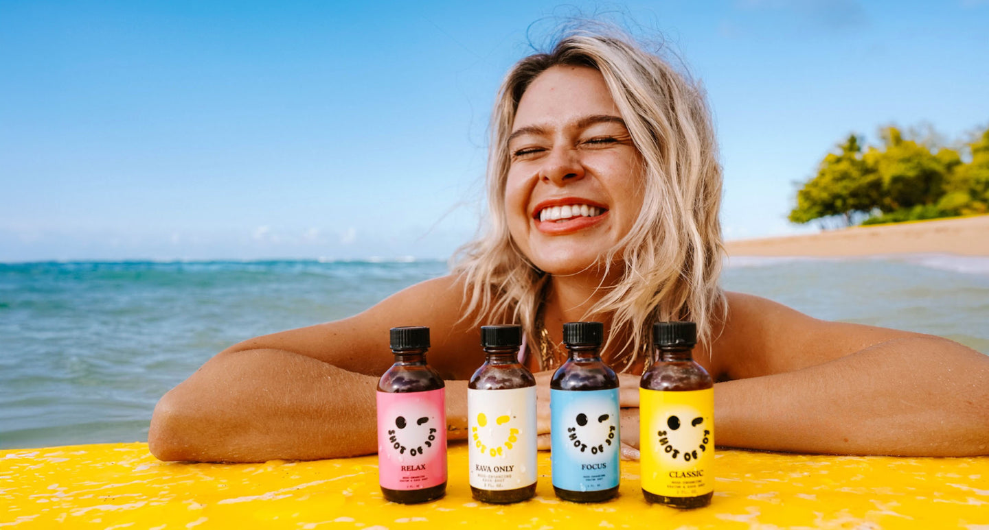 Shot of Joy botanical bottles on a sunny beach